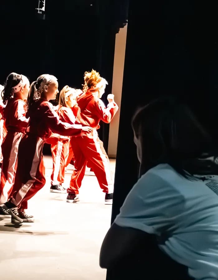 Young dancer performing on stage at Ashland Dance Academy