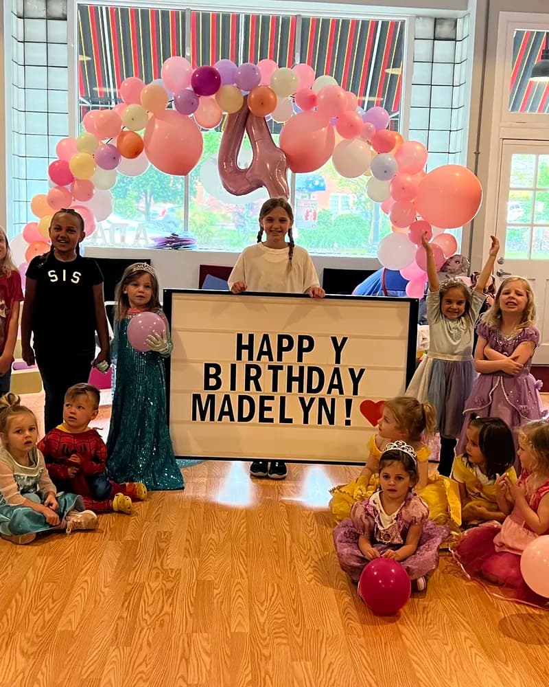 Kids in princess costumes celebrating at Ashland Dance Academy