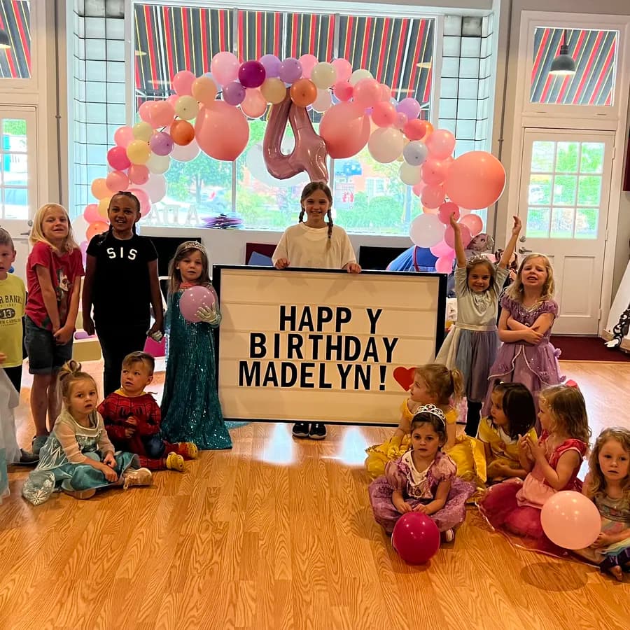 Kids in princess costumes celebrating at a birthday party at Ashland Dance Academy