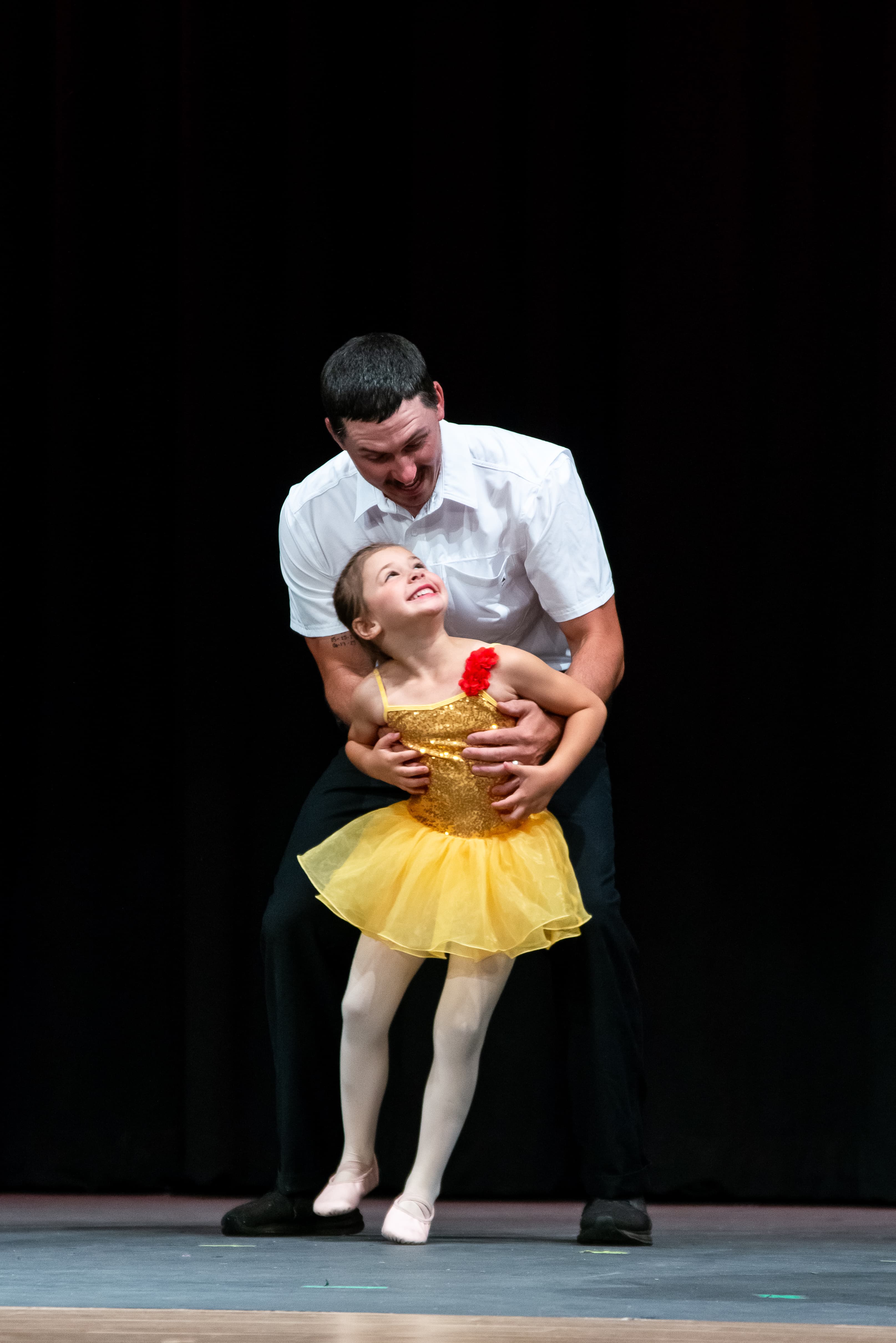 A dad and daughter dancing together at Ashland Dance Academy